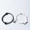 Pulseira de Pedra dos Desejos de Amor Preto e Branco Transfronteiriça para Amantes Costura de Coração Partido Corda de Mão Trançada Magnética Ajustável Homens e Mulheres Atacado