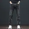 Jeans rectos de ajuste slim de alta gama en negro y gris para hombre de Hong Kong, nuevos pantalones largos casuales elásticos de otoño para uso en exteriores
