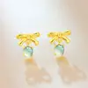 Aretes de Jade Azul Agua de Jadeíta Natural Libro Rojo con Moño Incrustaciones de Oro y Diseño Fresco