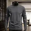Camiseta casual versátil de manga larga para hombre para otoño, cuello redondo, color liso moderno, cómoda, transpirable y de corte holgado.