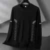 Temporada de primavera y otoño, camiseta lisa popular de manga larga, corte holgado, cuello redondo, unisex, top simple y versátil