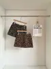 Saia Curta A-Line Leopard Print Espessada de Cintura Alta Outono e Inverno 2026 Justa no Quadril para Mulheres Baixas, Novo Estilo Sexy Lã de Cordeiro