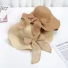 Novo Chapéu de Palha Tecido de Verão da Moda para Mulheres, Chapéu de Sol de Praia com Aba Larga para Proteção Solar, com Laço e Formato Ondulado