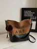 Bolsa Balde Fosca de Grande Capacidade Retrô para Mulheres Nova Moda Outono e Inverno 2025 com Listras Bolsa de Ombro Transversal para Mulheres