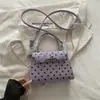 Bolsa feminina transfronteiriça com fecho de fivela, nova tendência outono 2026, bolinhas, super popular, de ombro e crossbody de alta qualidade para o trabalho