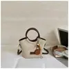 Otoño 2026 Nuevo Lanzamiento Bolso de Hombro Único para el Trabajo y el Viaje Bolso Cruzado de Moda Estilo Coreano Nicho Bolso de Cubo Sencillo de Mano Moderno