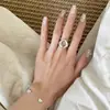 Industria Pesada Textura de Viento Frío Fresco Minimalista Anillo Moda Femenina Versátil Forma de Huevo Personalidad Cristal Blanco Nicho Anillo Abierto