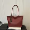 Outono 2026 Nova Moda Textura Tecida Grande Capacidade Luxo Leve Estiloso Simples Versátil Cor Sólida Ombro Único Mão Bolsa Tote