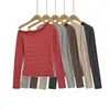 Atacado de Roupas Femininas Transfronteiriças Estilo Europeu e Americano 2025 Outono e Inverno Nova T-shirt Listrada de Manga Longa com Bloqueio de Cor Uma Alça Top Interno