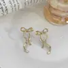 Nuevos aretes de lazo de cinta transfronterizos, aretes simétricos de moda, aretes del mismo estilo más vendidos en Amazon, venta al por mayor del fabricante