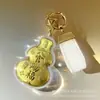 Colgante para Teléfono de Oro Puro 999 con Diseño de Flor y Luna, con 20Mg de Oro, Llavero, Mini Estuche para Auriculares, Estuche para Labial, Portátil