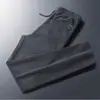 Liquidação Comércio exterior pedido original Manuseio de rejeitos Marca da moda Calças Esportivas Casuais Masculinas Retas Largas Calças de Moletom de Veludo