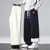 Pantalones de Alpaca para Hombre Otoño e Invierno 2025 Nuevos Pantalones de Algodón Gruesos de Terciopelo Cálidos Sueltos Rectos Casuales