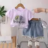 Ropa para Niñas Exportación Linda Estampado de Letras Colorido Cuello Redondo 2026 Encaje Perla Moño Manga Corta Nuevo Verano Conjunto de Dos Piezas