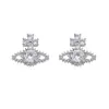 Brincos Saturno de Alta Qualidade para Mulheres, Estilo de Luxo Leve, Brincos Versáteis, Design de Nicho Popular, Brincos de Agulha de Prata com Zircônia Totalmente Diamantada