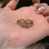Anel de trevo de quatro folhas~cheio de diamantes de zircônia, anel aberto ajustável para o dedo indicador, novo estilo de nicho anel de folha da sorte para mulheres