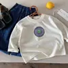 Otoño 2026 Huzhou Zhili Ropa Infantil Estilo Coreano Camiseta Básica de Manga Larga para Niños y Niñas Primavera y Otoño Camiseta Beige