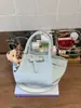 Bolso tipo cubo versátil y de alta gama con patrón de lichi para mujer, nuevo diseño de principios de primavera 2026, bolso de mano y bolso cruzado únicos y exquisitos