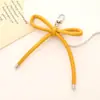Novo PU Corda de Couro Chaveiro Pingente Bolsa Cadeia Pendurado DIY Simples All-match Bow Cordão Do Telefone Móvel