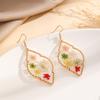 Europa y Estados Unidos transfronterizo nueva moda forma de mariposa aretes de flor seca aretes joyería