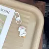 Lindo llavero de foca adorable de dibujos animados, bollo de pudín, amuleto femenino para mochilas de estudiantes, regalo para mejores amigas