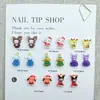 Adornos Navideños de Dibujos Animados Sanrio para Uñas Ciervo Lindo Santa Gato Kt Decoraciones para Uñas y Aretes DIY