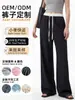 Pantalones de traje personalizados para hombre alto talla extra, de seda de hielo, contraste blanco y negro, corte estrecho, diseño transfronterizo y patronaje de fábrica de ropa de muestra