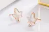 Agita el sonido de los nuevos pendientes de arce blanco para mujer estilo ins viento frío estilo coreano temperamento aretes pequeños para orejas joyería para el oído venta al por mayor