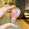 Llavero creativo de piruleta rellena de aceite con arena líquida, colgante flotante de helado, colgante para bolsa al por mayor, decoración linda
