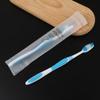 Cepillo de dientes desechable con pasta dental habitación de hotel plástico cerdas suaves en stock utensilios dentales artículos de tocador para casa de huéspedes venta al por mayor