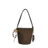 Bolsa bucket casual vintage para usar sob o braço, nova bolsa de ombro versátil outono/inverno 2025, bolsa transversal de nicho de alta qualidade para o dia a dia