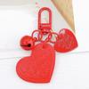 Yi Lian Jewelry - Llavero con colgante de campana de cuero con forma de corazón, ideal como regalo para niña