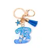 Llavero Colgante Temático Océano Azul con Borla de Estrella de Mar, Llavero de Resina Encanto para Bolso con 26 Letras