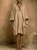Novo vestido midi liso de bolso de marca independente 2026 Europeu e Americano Decote V Mangas Morcego Amazon Oversized Caimento Solto