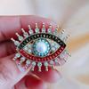 Broche Nuevo Retro Exagerado Ojo del Diablo Personalizado Abrigo de Mujer Aleación Incrustado con Perla de Agua Dulce Ramillete Accesorios de Traje