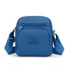 Bolso bandolera multicapa de nailon para mujer, bolso cruzado ligero, mochila pequeña simple y versátil de tela Oxford, mochila para mamá