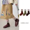 1742 Calcetines infantiles al por mayor, nuevos estilos otoño/invierno, con un diseño único de flecos, longitud a media pantorrilla, hechos con algodón peinado y construcción sin costuras, para niñas