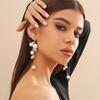 Joyería transfronteriza europea y americana diseño de moda aretes de borla de perla de imitación temperamento dulce y cool aretes de metal con cuentas para mujer