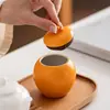 Creativo pequeño recipiente de té naranja, tarro de cerámica sellado a prueba de humedad para almacenamiento de té, recipiente de té portátil con impresión de logotipo