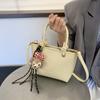 Bolso de Cubo de Mano de Alta Gama de Moda Transfronteriza Primavera/Verano 2026 Bolso de Hombro Simple Versátil Bolso Cruzado de Nicho de Moda