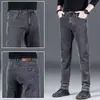 Pantalones vaqueros gruesos con forro polar de invierno para hombre, pantalones holgados y rectos, pantalones casuales elásticos negros de alta gama para primavera y otoño para hombre.