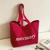 Bolso de hombro casual de lona con estampado de letras estilo ins coreano para mujer, nuevo modelo 2026, bolso tote de gran capacidad