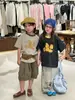 Nova Camisa Infantil de Manga Curta Estilo Coreano Verão 2026 com Gola de Cor Contrastante para Meninos e Meninas
