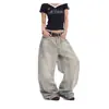 Nuevos jeans de bajo curvo con diseño retro, versátiles para hombre y mujer, corte holgado, pantalones de pierna ancha tipo guadaña hasta el suelo para primavera y otoño