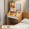 Tocador sencillo y minimalista con espejo para uso doméstico, adecuado para dormitorios pequeños, que ofrece almacenamiento fácil y múltiples funciones