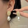 Pendientes Exquisitos de Perla Ovalada Coreana Estilo Retro Francés Lujo Ligero Nicho Diseño de Alta Gama