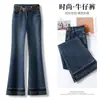 Jeans acampanados de tiro alto azul oscuro hechos a medida para mujer, pantalones retro de campana ajustados con ribete de encaje para otoño