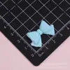Gravata borboleta nó de laço DIY acessórios feitos à mão auto-feitos cola de creme capa de celular materiais para acessórios de cabelo Acessórios de resina para Crocs