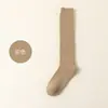 Calcetines populares de rizo de algodón para mujer, engrosados para invierno, que brindan calidez y resistencia al frío, calcetines largos estilo JK japonés para uso en interiores