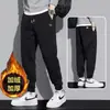 Pantalones térmicos con forro polar transfronterizos, nuevo estilo otoño/invierno, nuevos pantalones deportivos, pantalones de chándal casual para niños, pantalones jogger de corte holgado para hombre